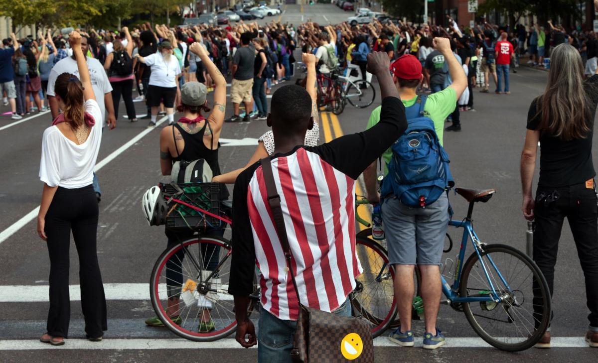 Protests continue downtown, based at police station