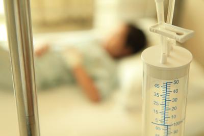 sick child in hospital bed