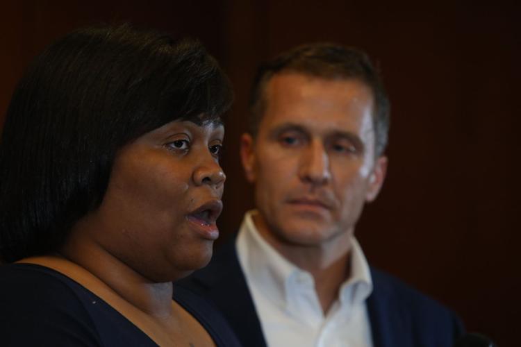 Governor Eric Greitens, right, and Christina Wilson, fiancée of Anthony Lamar Smith