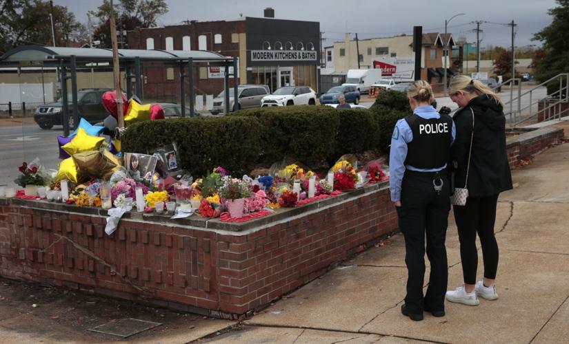 Memorial grows to student, teacher killed in high school shooting