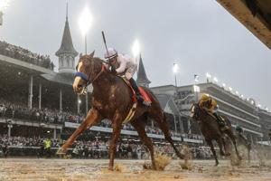 Justify, with Mike Smith aboard, wins the 144th running of the Kentucky Derby at Churchill Downs in 2018.