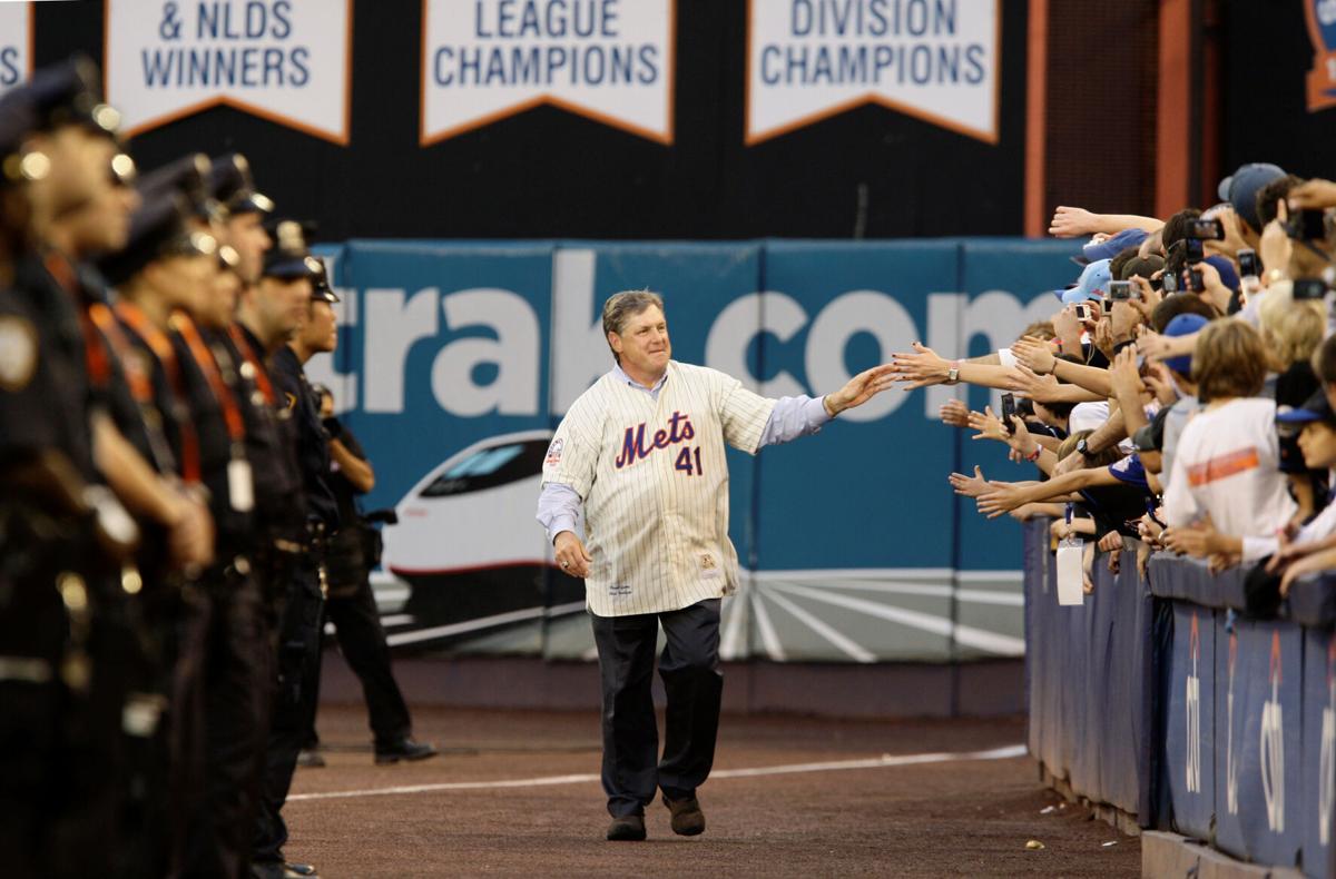Former New York Met Tom Seaver throws the final pitch during the closing  ceremony of Shea Stadium following the Mets final regular season game  against the Florida Marlins on September 28, 2008
