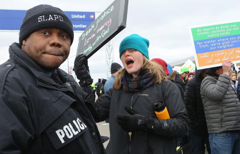 Protesters converge on Lambert over Trump policies