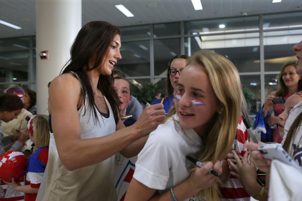 U.S. Women's National Soccer Team greeted by dozens of youth fans at airport