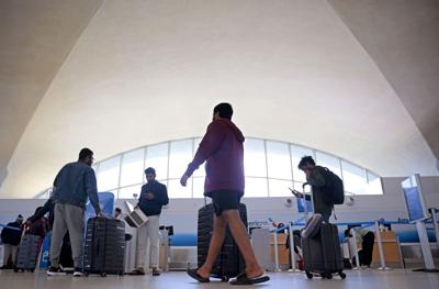 Passengers flow through at 51 Lambert International Airport for Thanksgiving holiday