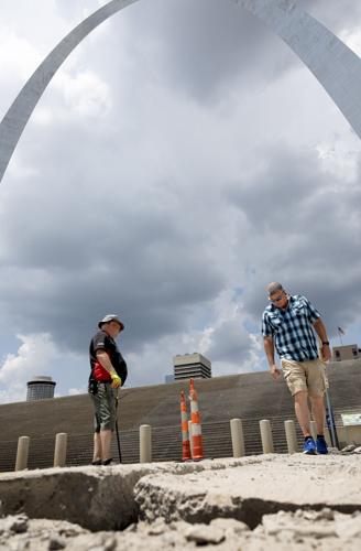 Heat buckles pavement on Leonor K. Sullivan Blvd. near Arch