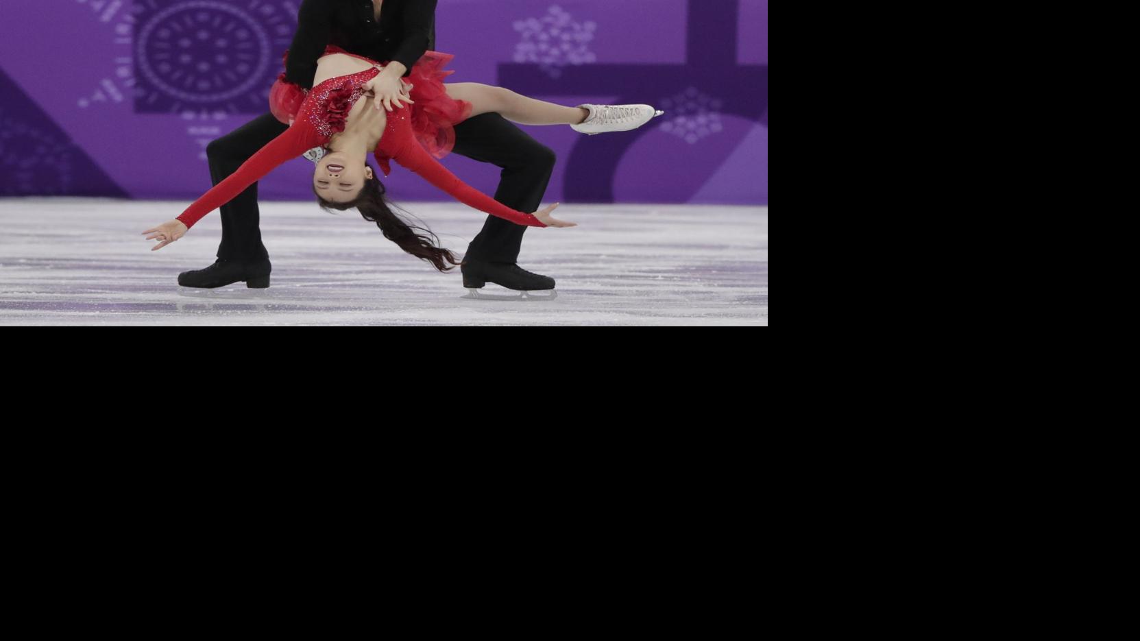 Whoops! Wardrobe malfunction forces skater to adjust her twizzle