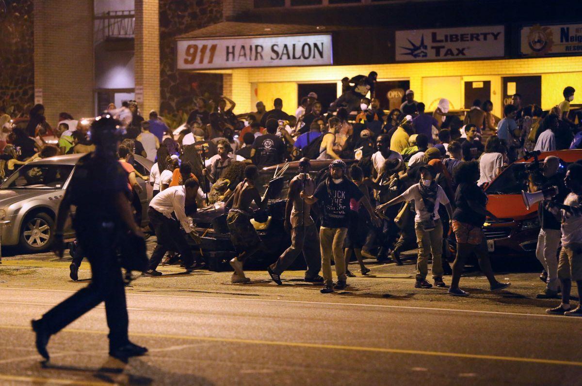 More than 100 arrested in day of Ferguson protests; night brings no