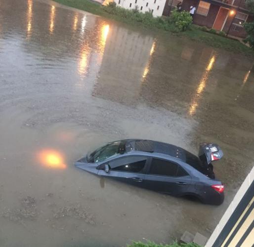 Flooding in Maplewood swamps cars on Laclede Station Road