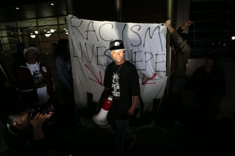 More than 150 demonstrators protest in front of Ferguson Police Station