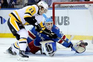 Pittsburgh Penguins right wing Ville Koivunen (41) takes a shot against New York Rangers goaltender Igor Shesterkin (31) during the second period at Madison Square Garden.