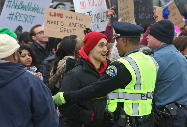 Protesters converge on Lambert over Trump policies