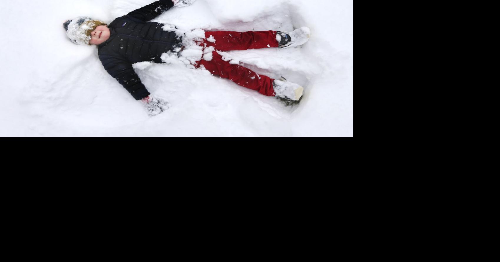 St. Louis shovels up 6 inches (more or less) as sledding rules a snow day