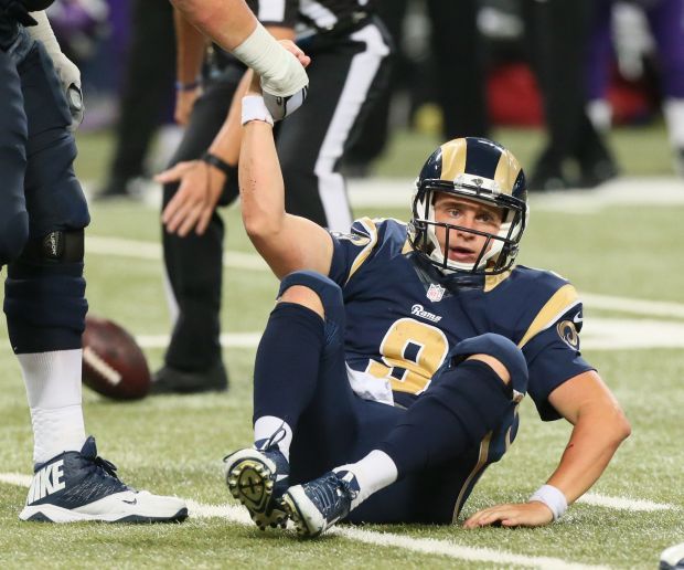 QB Davis debuts in second half, faces pressure