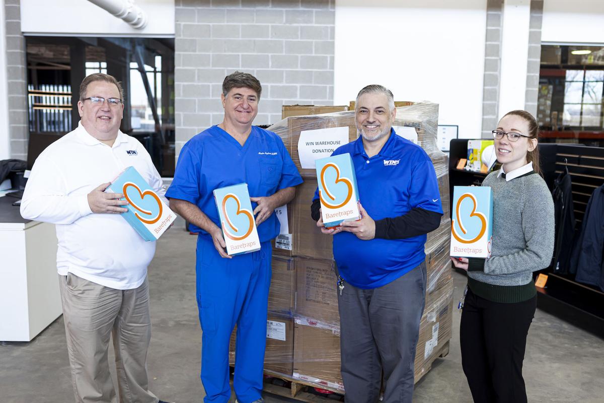 Dr. Aquino and WIN Warehouse Shoe Donation
