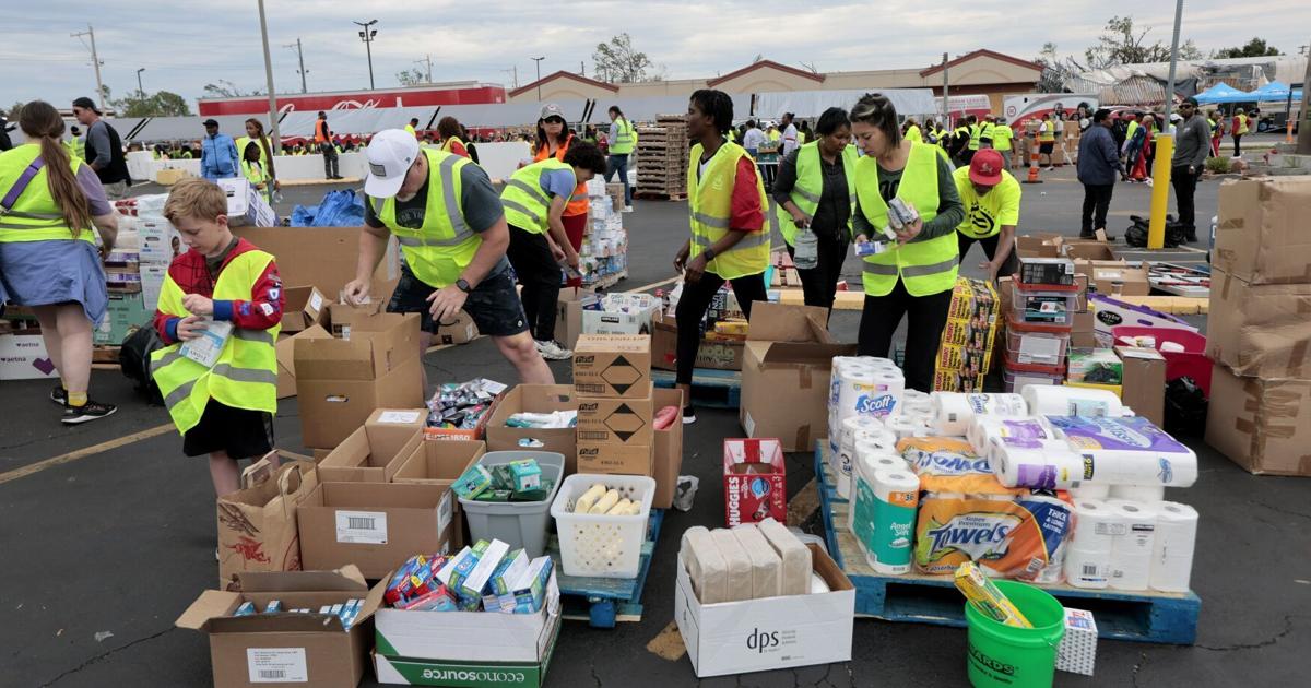 Image for article Thousands get food, supplies at Urban League of St. Louis event. More relief is planned.