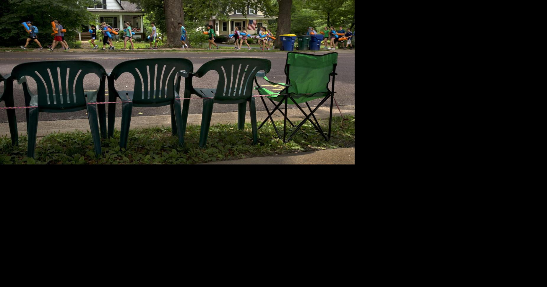 Each year, chairs staking out prime parade spots in Webster Groves
