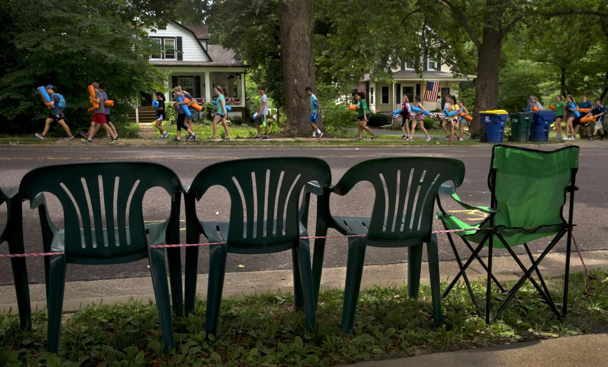 Each year, chairs staking out prime parade spots in Webster Groves