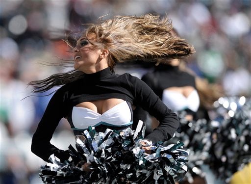 An Arizona Cardinals cheerleader performs in a Halloween costume