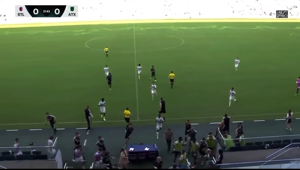 Players evacuate the pitch after shots fired outside St. Louis soccer stadium