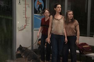 Movie review: Anne Hathaway adds taking on T. rex to talents in 'The End of Oak Street'