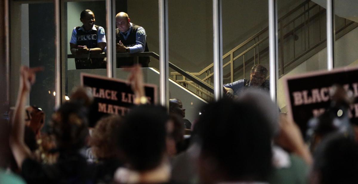 Protests continue downtown, based at police station