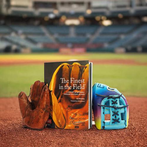 Ed Wheatley's 'The Finest in the Field' book presented by Rawlings with two gloves