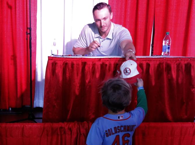 St. Louis Cardinals catcher Andrew Knizner signs autographs