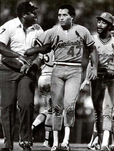 Joaquin Andujar of the St. Louis Cardinals is carried off the