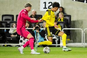 St. Louis CITY SC defender Lukas MacNaughton (5) grabs the jersey of Columbus Crew midfielder Taha Habroune (16) during the U.S.