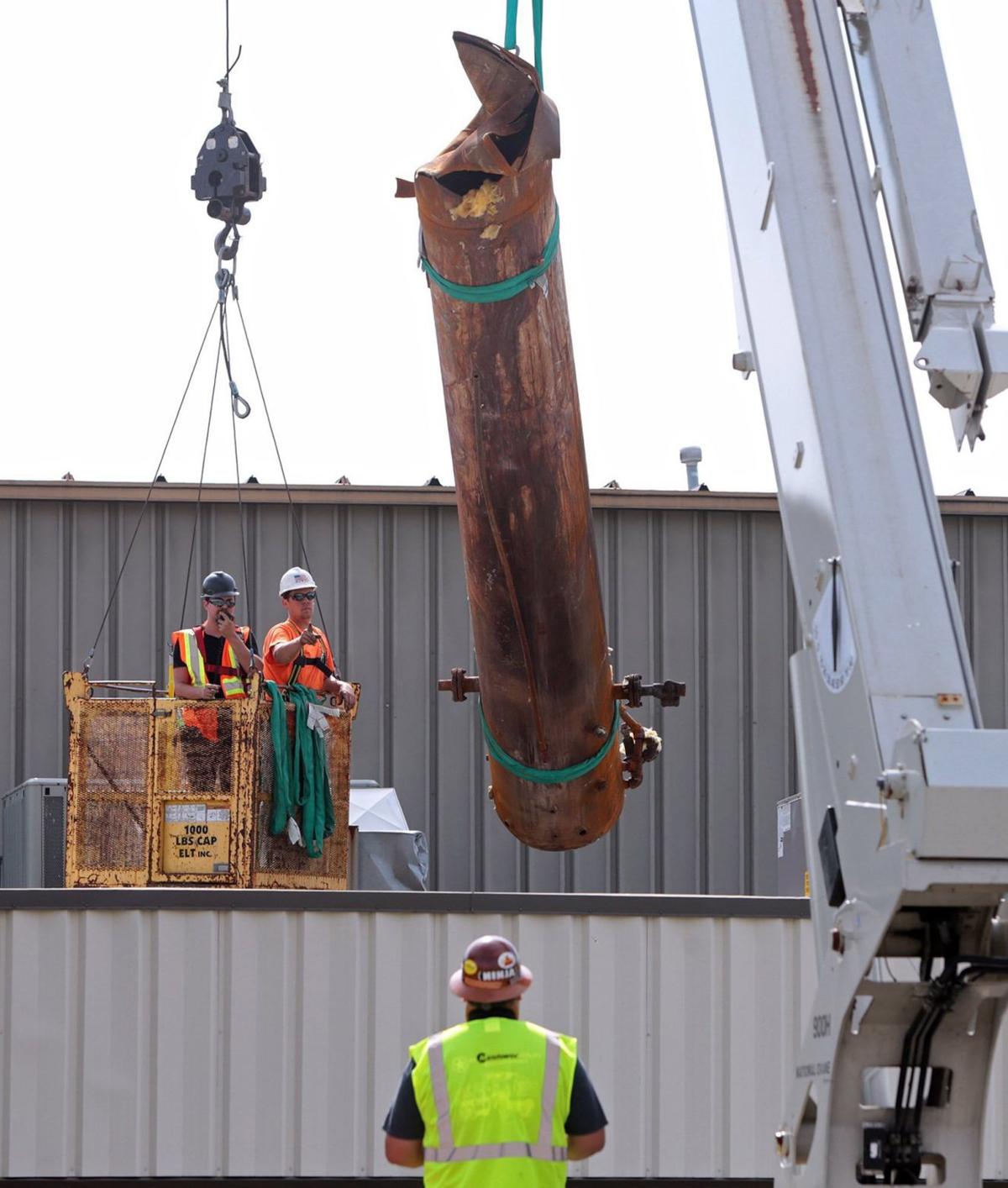 Cranes to remove large tank that exploded and killed four people