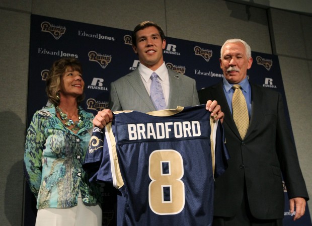 NFL overall No. 1 draft pick, St. Louis Rams quarterback Sam Bradford,  throws a ceremonial first pitch before the Milwaukee Brewers - St. Louis  Cardinals baseball game at Busch Stadium in St.