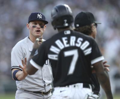 New York Yankees third baseman Josh Donaldson, left, and Chicago White Sox baserunner Tim Anderson, right, share words at third base in the first inning at Guaranteed Rate Field in Chicago on Friday, May 13, 2022.