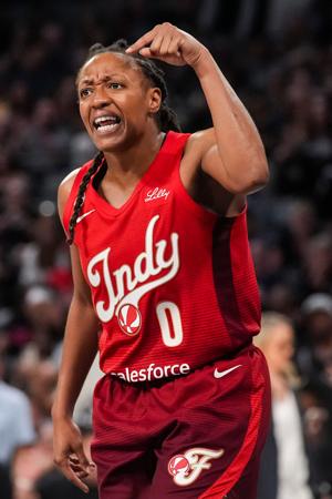 Indiana Fever guard Kelsey Mitchell (0) reacts to a call Thursday, Oct. 1, 2026, during the second half of Game 3 of the first