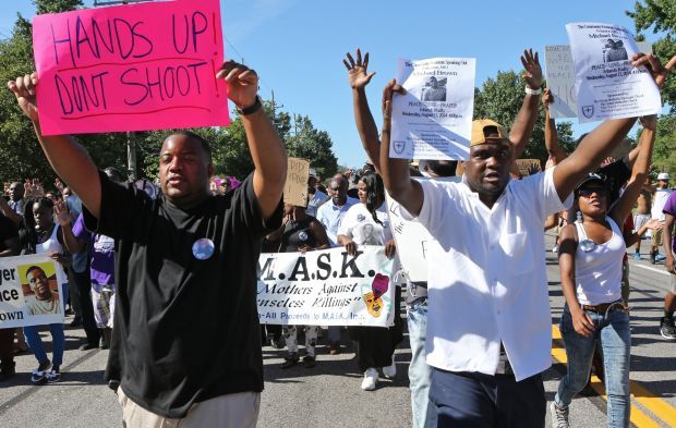 Ministers try peaceful protest through Ferguson