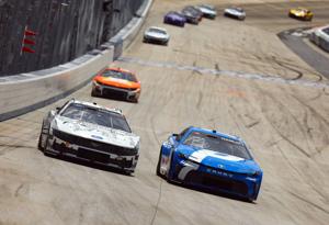 Denny Hamlin takes the lead in the NASCAR All-Star Race at Dover Motor Speedway.