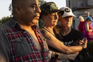 Community holds vigil for Overland couple slain after deportation