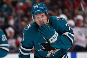 San Jose Sharks center Macklin Celebrini adjusts his mouthpiece during a break in the action against the Edmonton Oilers at SAP Center at San Jose.