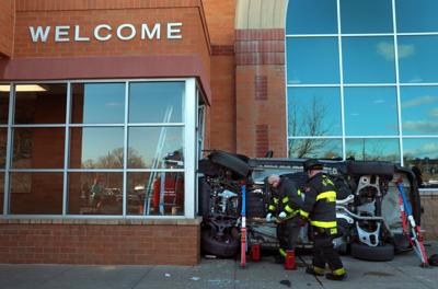 Firefighters rescue man, woman as car crashes into grocery