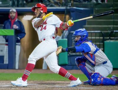 Peoria catcher Rainiel Rodriguez watches his hit leave the infield for a base hit against South Bend during the Chiefs' home opener Tuesday, April 7, 2026 at Dozer Park. The Chiefs routed the Cubs 10-1.