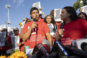 Community holds vigil for Overland couple slain after deportation