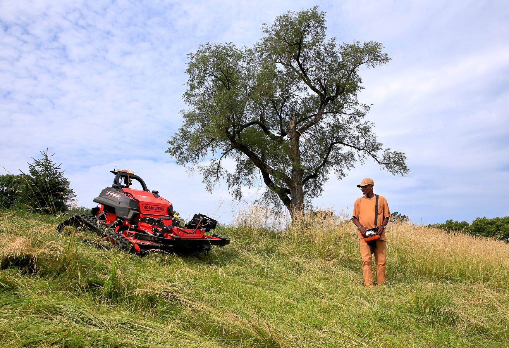 Remote controlled mower takes on Forest Park It s like Pac Man