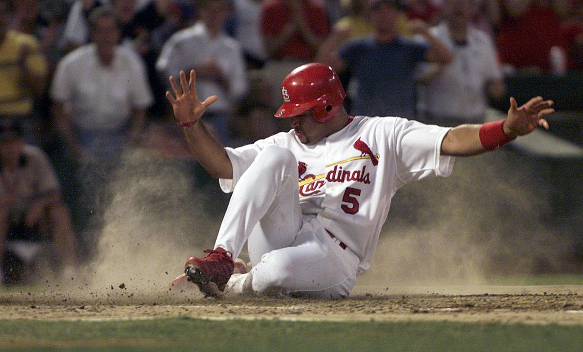 St. Louis Cardinals' Edgar Renteria hits a tie-breaking, two-run