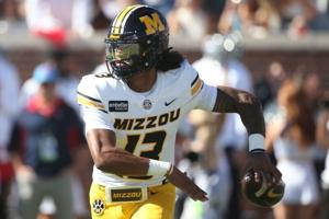 Oct 17, 2026; Oxford, Mississippi, USA;  Missouri Tigers quarterback Austin Simmons (13) throws a pass during the first quarter against the Mississippi Rebels at Vaught-Hemingway Stadium.  Mandatory Credit: Petre Thomas-Imagn Images