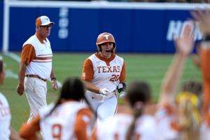 Texas Longhorns utility Katie Stewart (20) celebrates after hitting a home run in the first inning of during Game 1 of the NCAA softball Women's College World Series finals between the Texas Longhorns and the Texas Tech Red Raiders at Devon Park in O