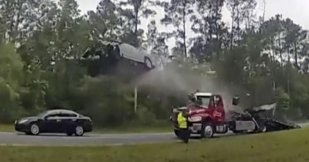 Driver whose car vaulted over tow truck says I thought I was going to die Driver whose car vaulted over tow truck says I thought I was going to die