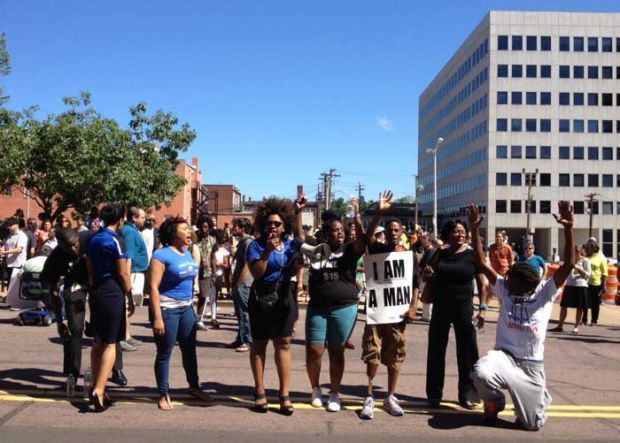 Protesters march in Clayton demanding justice for Michael Brown