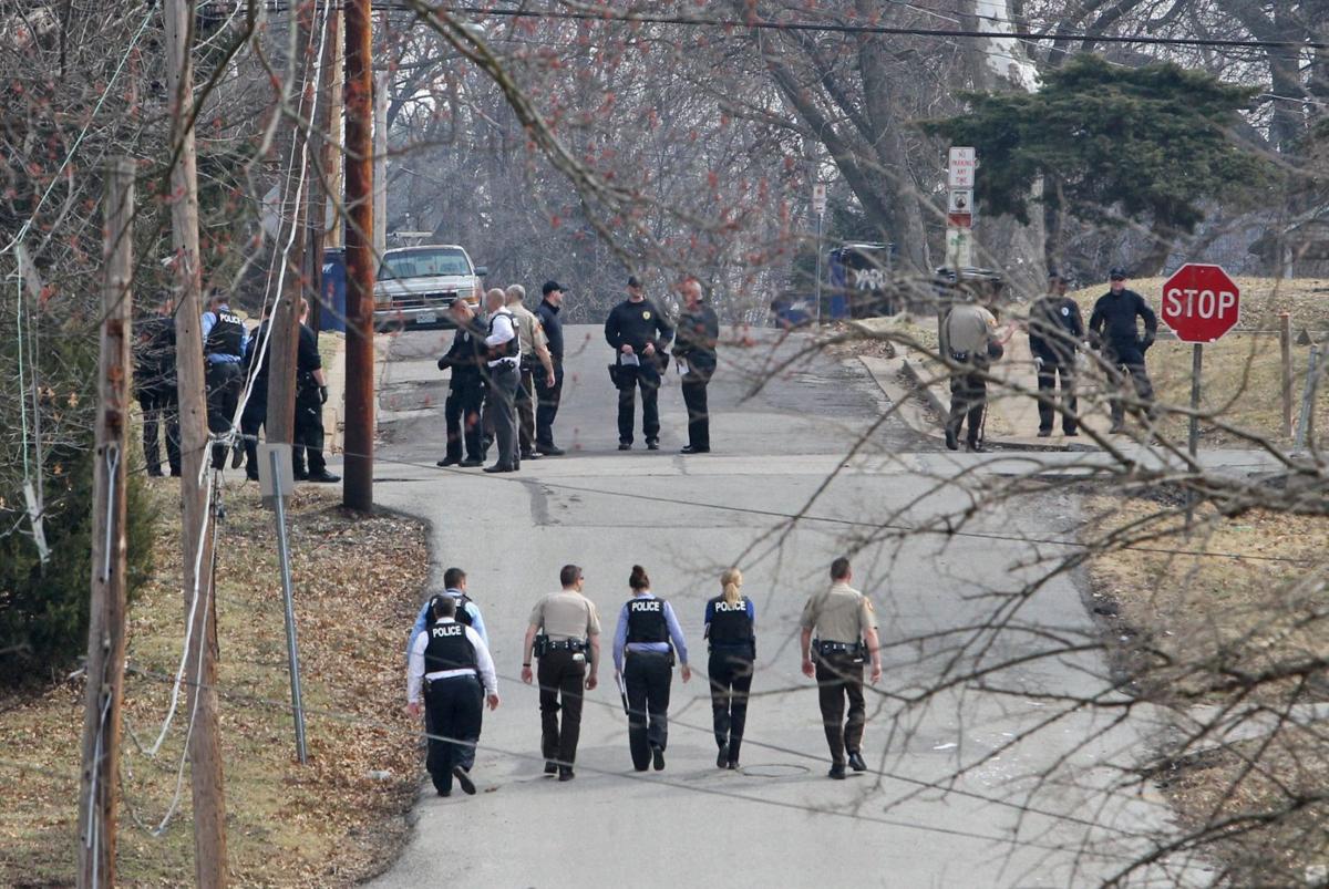 Police raid house in Ferguson looking for shooter