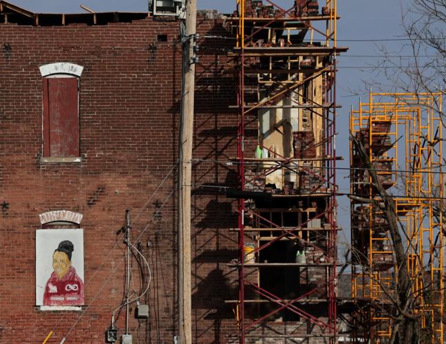 Tornado puts many of artist Chris Green’s Page Avenue portrait murals at risk