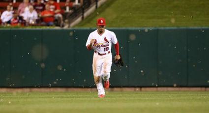 St. Louis Cardinals Vince Coleman, center, lies on the field of